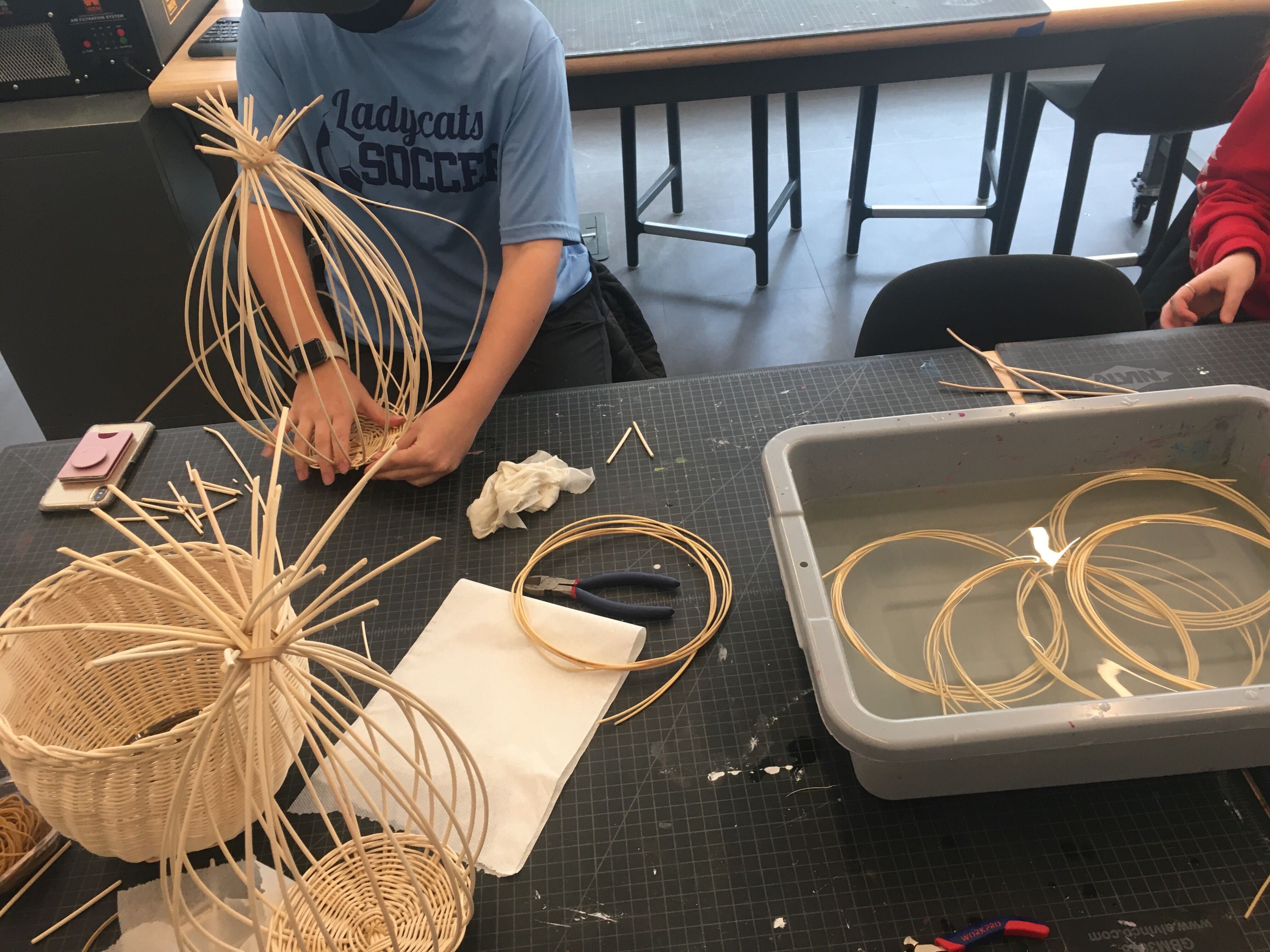 Image of students working on basketmaking in the Design Center