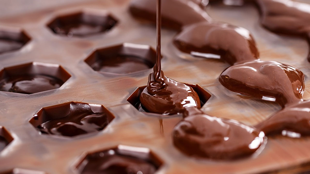 Image of chocolate being poured into a plastic mold